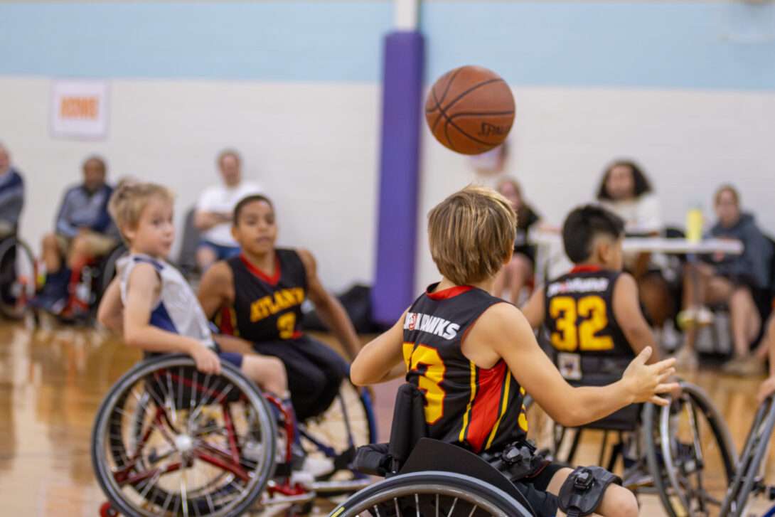 BlazeSports wheelchair basketball prep team smiling for group photo